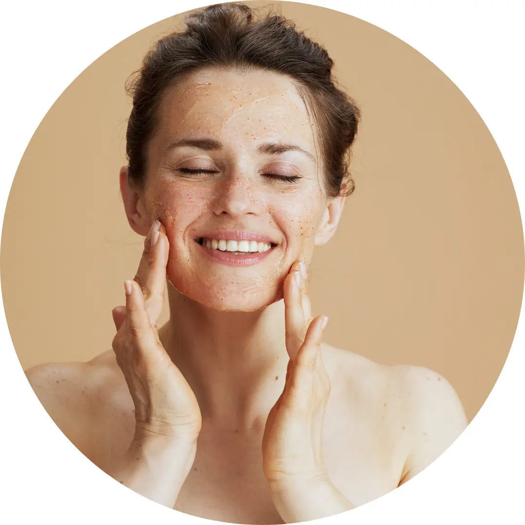 woman using buddha beauty facial scrub 