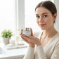 woman holding facial cleansing balm