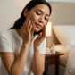 woman applying rational serum from alchemy of skincare